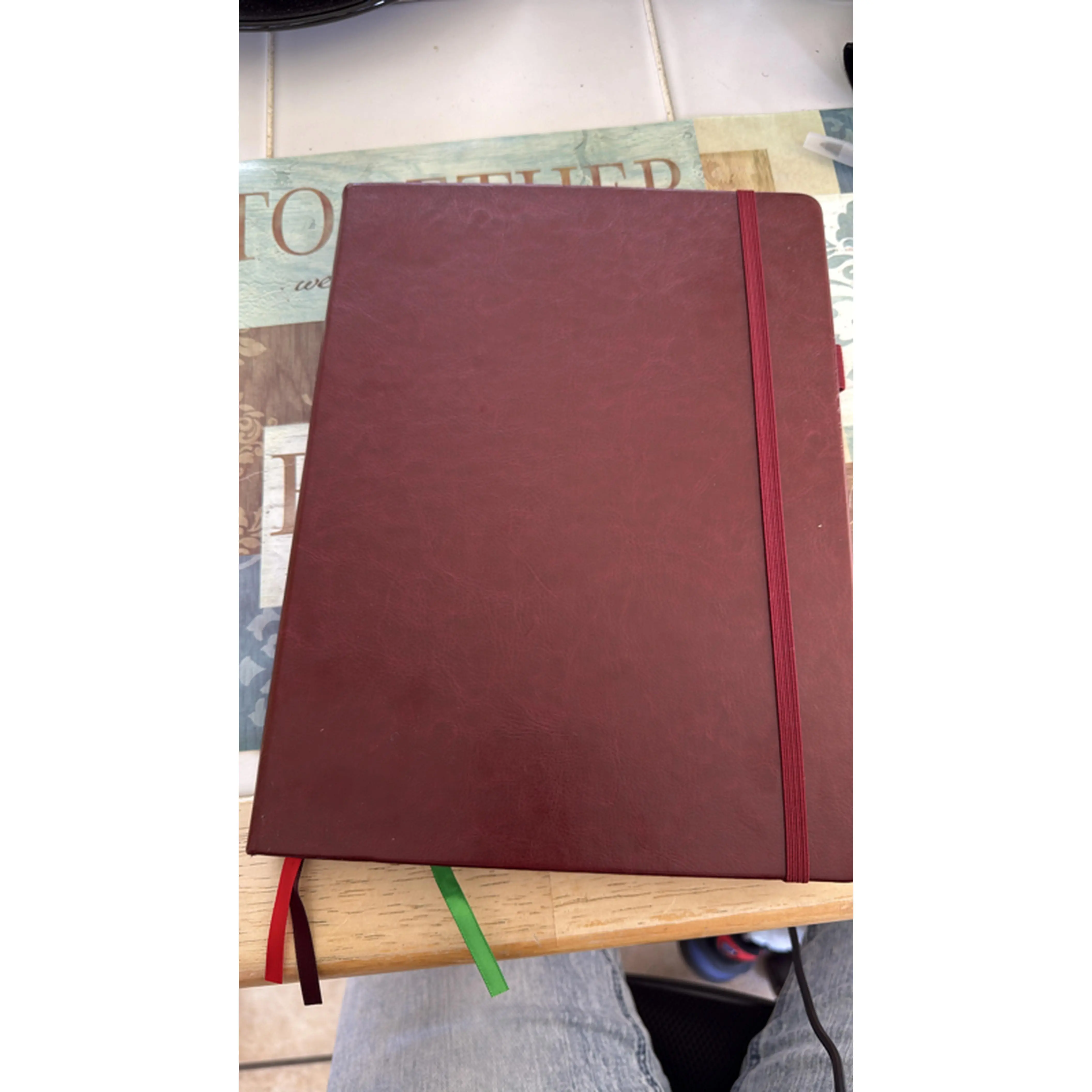 Red Notebook with Red Elastic Band and Green Bookmark