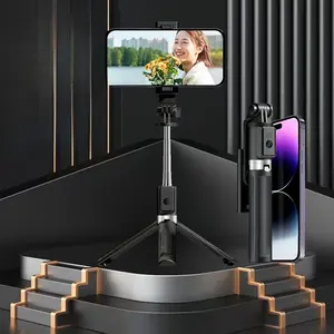 Bluetooth selfie stick with integrated tripod, extendable and portable handheld selfie tool, capable of taking overhead shots