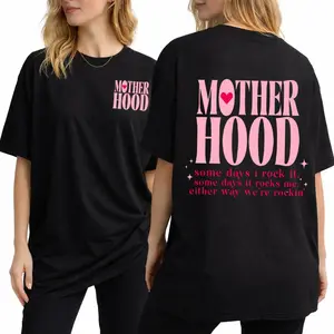 graphic tees for women cute tops, oversized black T-shirt with vintage pink 'Motherhood' print, t shirts women's graphic tees, vintage graphic tees, casual streetwear style