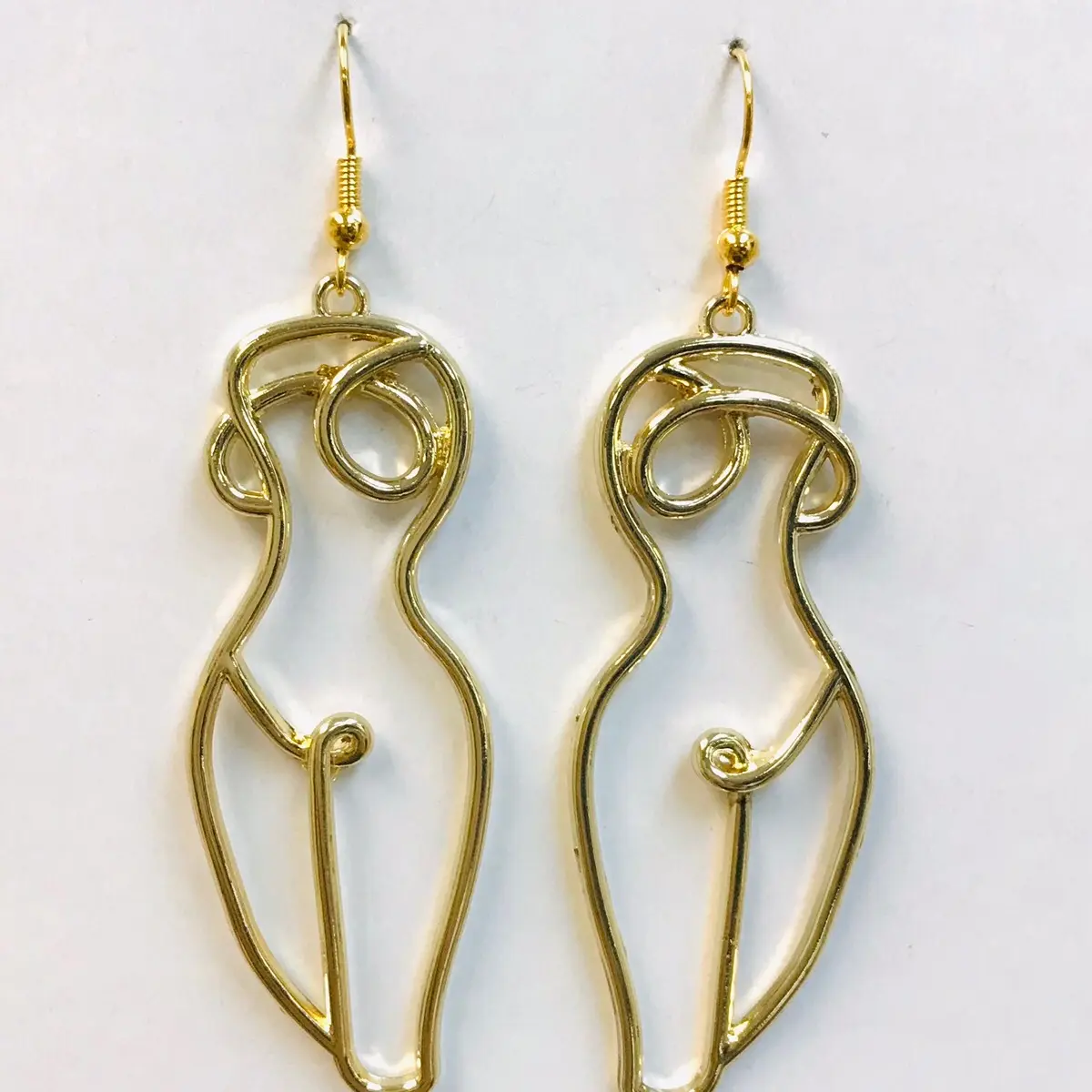 Naked woman body earrings