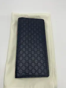 Pre-owned GUCCI black full leather embossed monogram long folding wallet with slight signs of use, size 17.5 × 9 cm