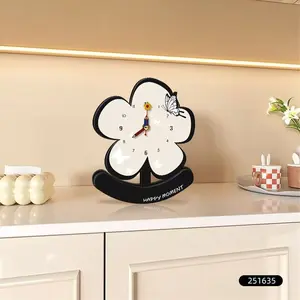 Modern minimalist mid-century style desktop clock for placement on TV cabinet or bedside, with crystal porcelain surface and floral design, used as decorative art.