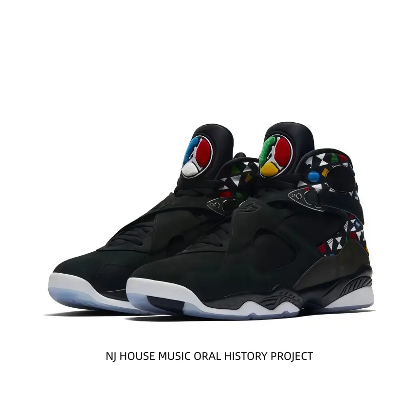 Black suede high-top sneakers matched with colorful geometric prints on ankle collars and vivid multicolor tongue logos. Adjustable buckle strap locks ankles firmly, cushioned sole fits streetwear and daily casual outfits perfectly.