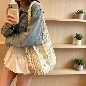 Lazy-style seaside commuter tote bag, vacation woven bag, women's summer pearl hollowed-out underarm bag, large capacity.