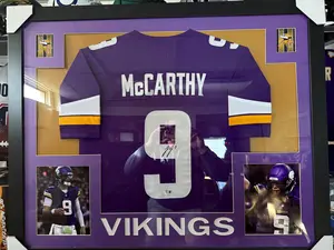 JJ McCarthy 43.5 x 35.5 autographed framed custom jersey. Jersey Auto Beckett Certified.