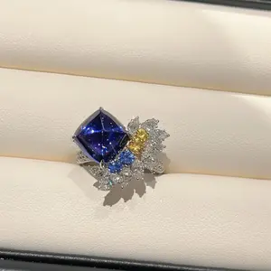 blue.A luxurious hand polished Moissanite ring paired with blue zircon. Exquisite craftsmanship.blue Sparkling Moissanite and zircon. Master level aesthetic design. Excellent quality. Brilliant and radiant. High quality hand polished. Unmatched talent.