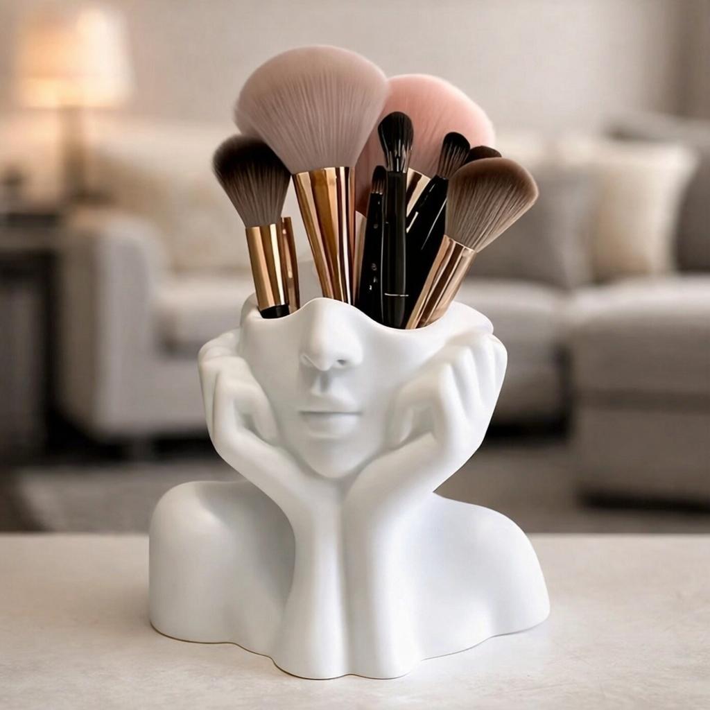 A Cute Makeup Brush Storage Box Shaped Like a Human Face • Featuring a Minimalist White Design That Captures The Relaxed Vibe of a Resting Face • This Artistic Piece for Your Desk Combines Practicality with Aesthetic Appeal