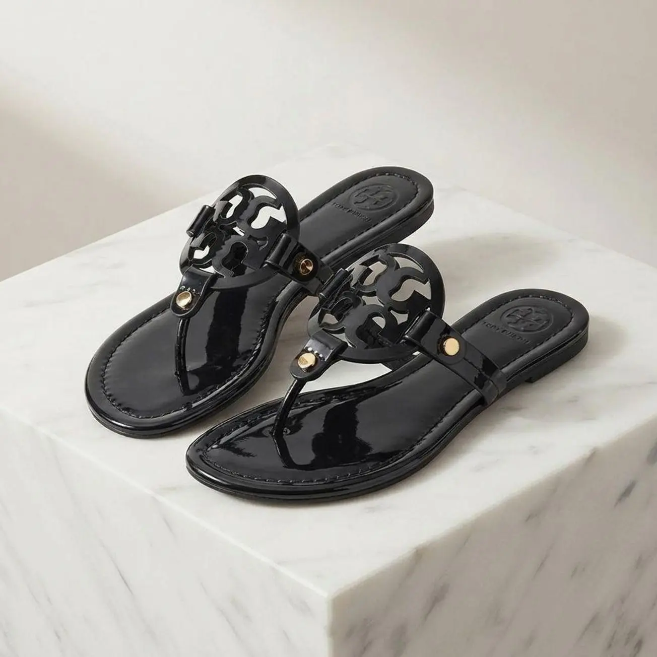 Women’s Glossy Flat Thong Footwear - Cutout Medallion T-Strap Slip-On Open Toe Casual Sandals for Summer Vacation