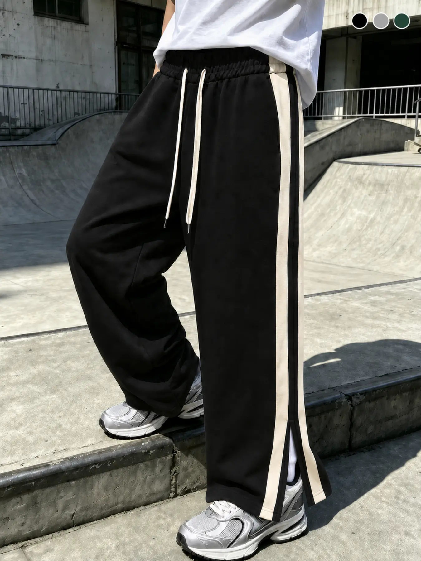 Men’s straight-leg sweatpants with side woven panels and slits, loose fit with elastic drawstring waist; relaxed athletic long pants with a fluid drape and wide legs; slit hem design adds visual depth; comfortable, soft fabric; elastic drawstring waistban