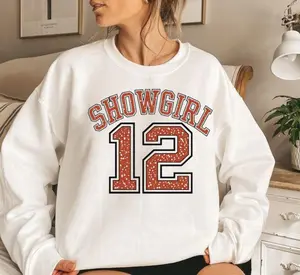 "SHOWGIRL 12" Classic Fit Crewneck Sweatshirt for Dance Teams & Performers | Sparkly Varsity Style Graphic Tee for Women | Comfortable Classic Fit Pullover Jumper