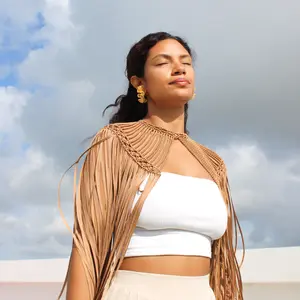 Handmade macrame bronze Cape with intricate weaving and flowy fringe.