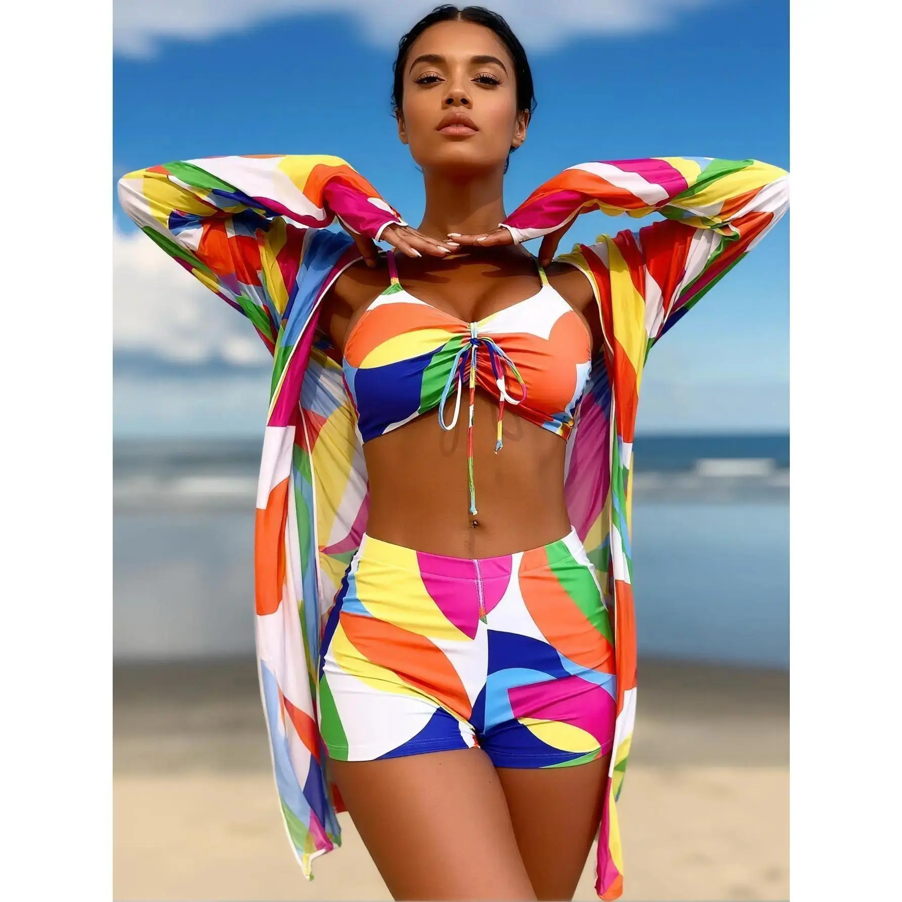 a must-have for beach vacations and the top choice for pool parties 2026 popular rainbow geometric print three-piece swimsuit set, colorful swimwear, lace-up front cropped top, high-waisted shorts, and matching long-sleeve sun protection cover-up, one