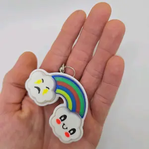 Clicky Keychain with Three Clicky Buttons and Angry and Happy Clouds with a Rainbow between them