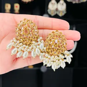 Elegant Polki Studs Earrings with Gold Tone and Pearl Accents for a Chic Look