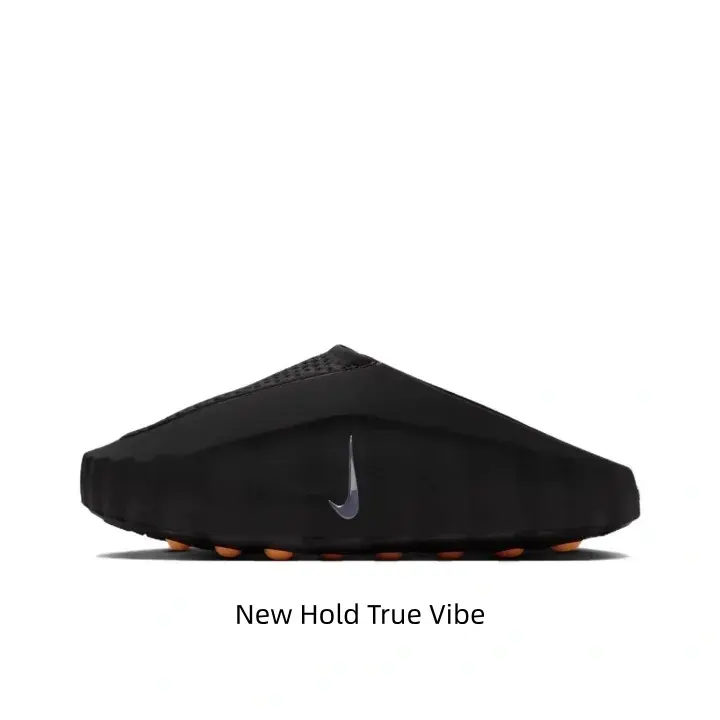 Sleek all matte black minimalist foam slides with pop orange massage contrast accents, unique wavy ripple silhouette, cool dark tone matches all streetwear & loungewear summer fits