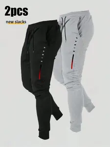 TikTok Viral 2pcs Graphic Jogger Pants – Black & Grey PARIS Letter Print Soft Cotton Fleece Slacks | Trendy Red Stripe Detail Streetwear Joggers | Mens Aesthetic Casual Daily Wear | TikTok Trending Drip Fit Comfortable Pants for Hangouts & Errands | Styli
