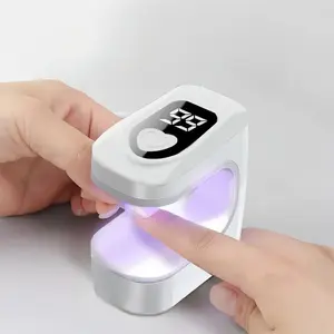 Mini UV + LED Dual-effect Nail Therapy Lamp with USB Charging and Portable Design. Equipped with a display for precise timing. Quickly cures nail polish. Anti-blackening nail dryer. Compact portable nail art device. Recommended by professional manicurists
