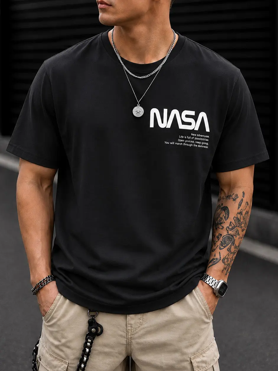 Men’s black loose-fit T-shirt featuring NASA logo and lettering print; relaxed fit with breathable fabric—ideal for home, office, and casual everyday outings.