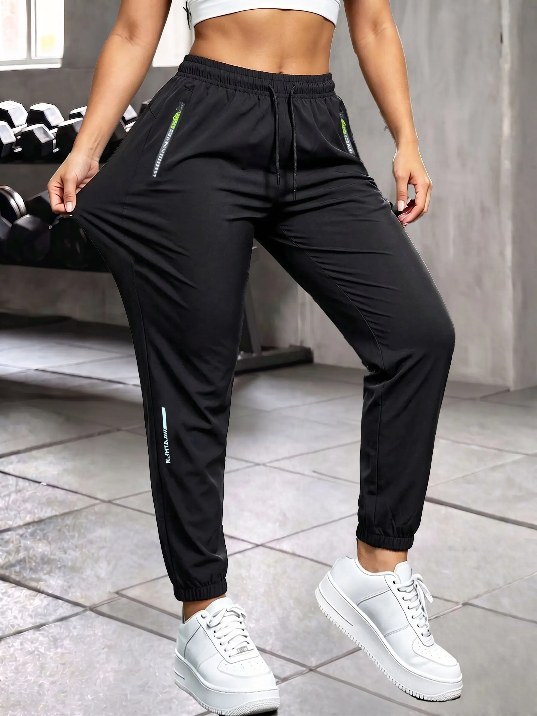 Women’s summer long pants with zippered pockets and a jogger fit; stretchy fabric with a stylish zipper design and an elastic waistband; casual outdoor sports and everyday wear long pants. Womenswear