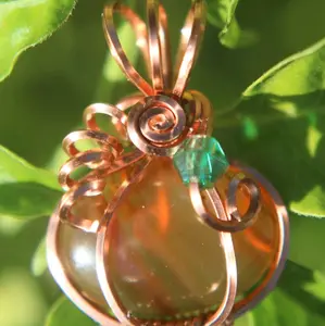 Copper Wire Wrapped Banded Carnelian Crystal Pumpkin Pendant with Green Leaf