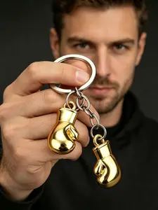 A fashionable mini boxing glove double button keychain with a hardcore metallic texture, making every day full of strength and personality. Suitable for daily commuting, casual dressing, birthday gifts, and men's gifts