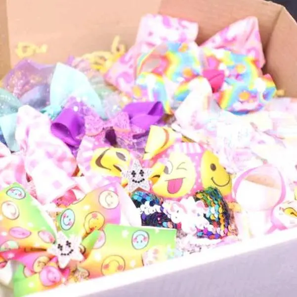 Girls Mystery Bow Box - 13 Bows with Alligator Clips, Including Solid and Patterned Prints, Rhinestones, and More many more. LOTS OF FUN, UNIQUE, AND CUTE MERCHANDISE ALL IN ONE BOX