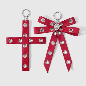 Set of 2 Y2K retro sweet‑cool hot‑girl punk fashion keychains/bag charms, multicolor leather with metal eyelets, patchwork design, cross rhinestone bow heart, DIY; suitable for sisters and best friends’ everyday outfits; great as a holiday gift.