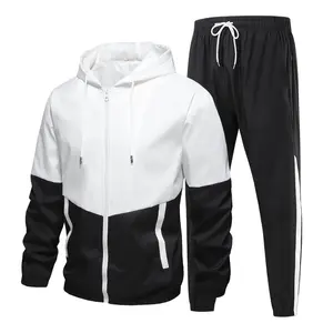 Men’s two-piece tracksuit set: color-block hooded windbreaker jacket and sweatpants; casual athletic jogging suit for men; lightweight, breathable running sportswear