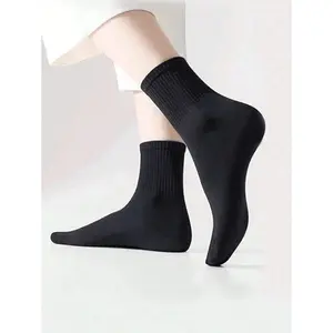 Men's and women's black and white mid-calf socks, breathable and comfortable, suitable for all seasons. Men's socks, 100% polyester knit fabric.