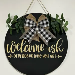 Welcome-ish Door Sign with Black and White Checkered Bow and Greenery Decorative Element