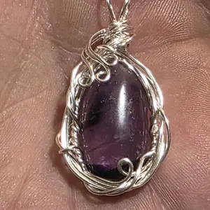 Amethyst Hand Wire Wrapped Pendant with 18" Silver Plated Chain. Suitable for any occasion.