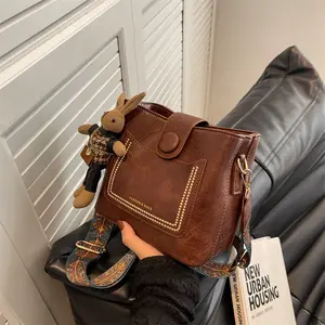 Fashion Square Bucket Bag Retro Style Crossbody Bags for Women with Adjustable Strap & Doll Pendant Compact Size Versatile Shoulder Bag