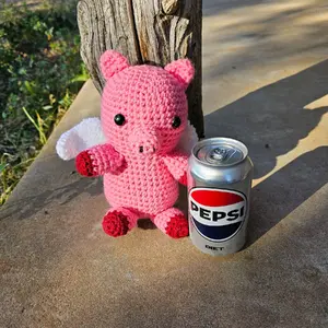 Hand crocheted pink flying bear