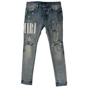 987154 Amiri Logo Patch Jeans Blue