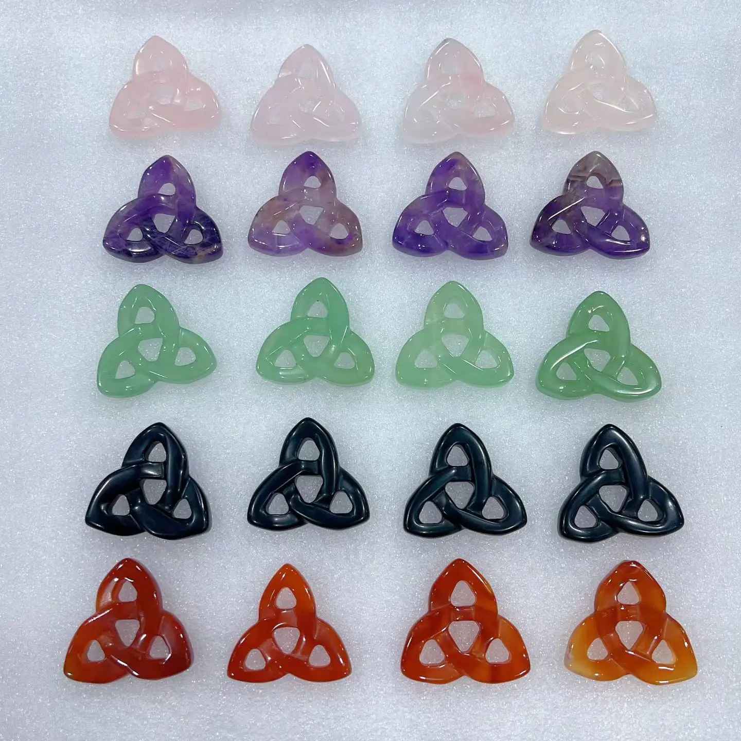 Mia(15097)gc.Hand-carved Celtic triquetra knots made of natural healing crystals, perfect for jewelry craft supplies