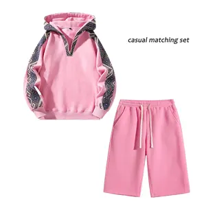 Men’s hoodie and shorts set featuring ethnic-style printed patchwork and soft fleece streetwear—casual everyday wear.