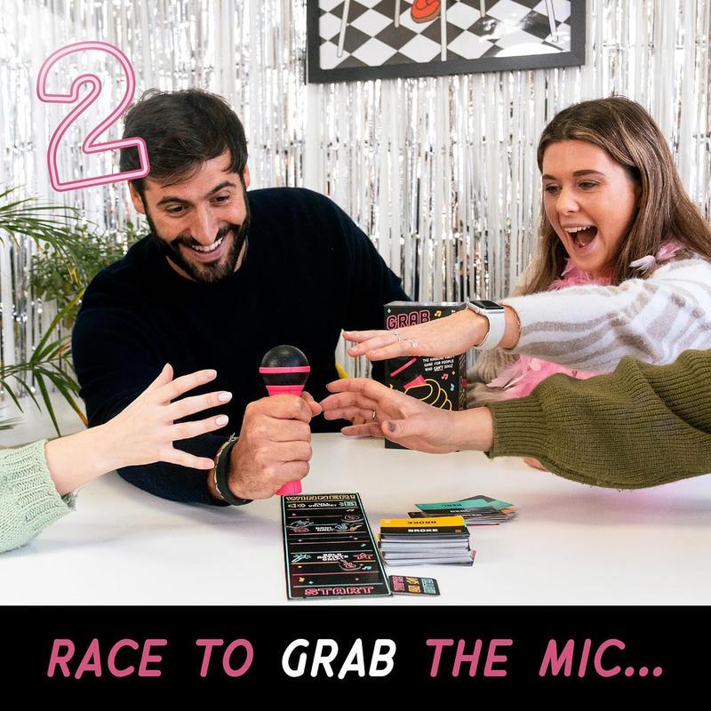Grab The Mic - Karaoke-Style Game with Foam Microphone, 125 Word Cards, Game Board, Player Tokens & Easy-to-Follow Instructions Grab The Mic - Karaoke-Style Game with Foam Microphone, 125 Word Cards, Game Board, Player Tokens & Easy-to-Follow Instructions