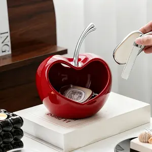 Crafted from ceramic, this decorative organizer serves a dual purpose: it functions as both a stylish ornament and a practical storage solution. It is perfectly suited for placement in your home's entryway, living room, or office desktop—helping you bid f
