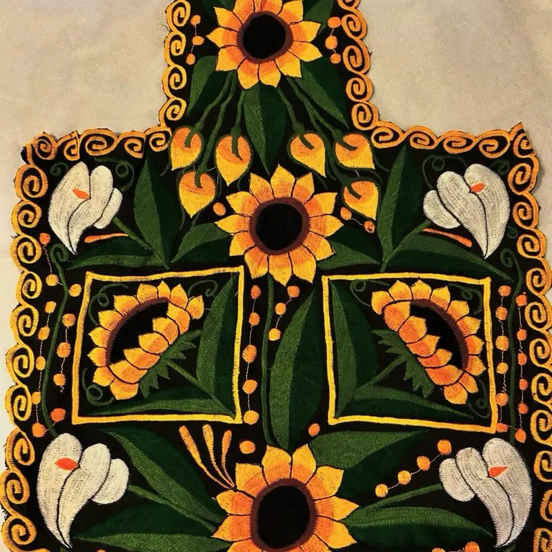 Mandil Artesanal Handcrafted Item with Colorful Floral Embellishments and Unique Design Elements