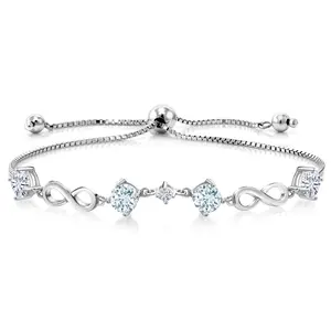 Gem Stone King Keren Hanan 925 Sterling Silver Women Adjustable Infinity Tennis Link Bracelet Round Sky Blue Aquamarine and Moissanite (2.07 Cttw)