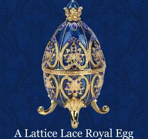Navy blue lace gold egg replica adorned with Austrian crystals. The intricate design features gold lace and a navy sparkle, standing at 4.2 inches.