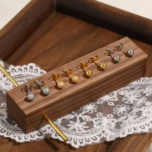 Stylish, simple and versatile temperament, niche matte smooth beanie stud earrings, female personality stacking titanium steel earrings