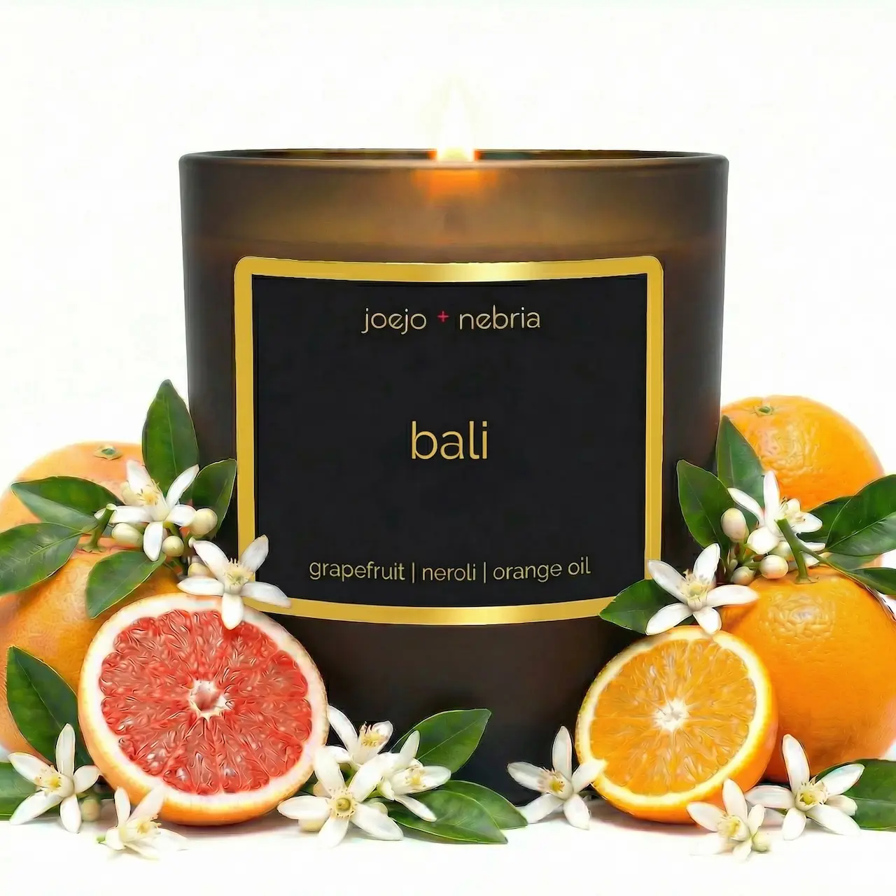 JoeJo + Nebria “Bali” — A coconut-apricot wax candle with grapefruit | neroli | orange oil. Comes in a vegan, reusable container perfect for repurposing.