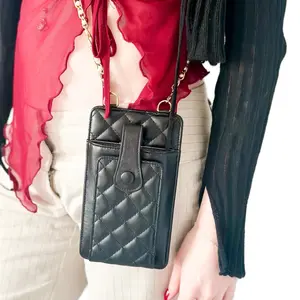 The “Everything” black pouch. With pearl gold chain. Can hold phone and credit cards. black party dual pouch