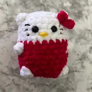 Hello kitty round plushie. Measurements 4 inches tall 3 inches wide