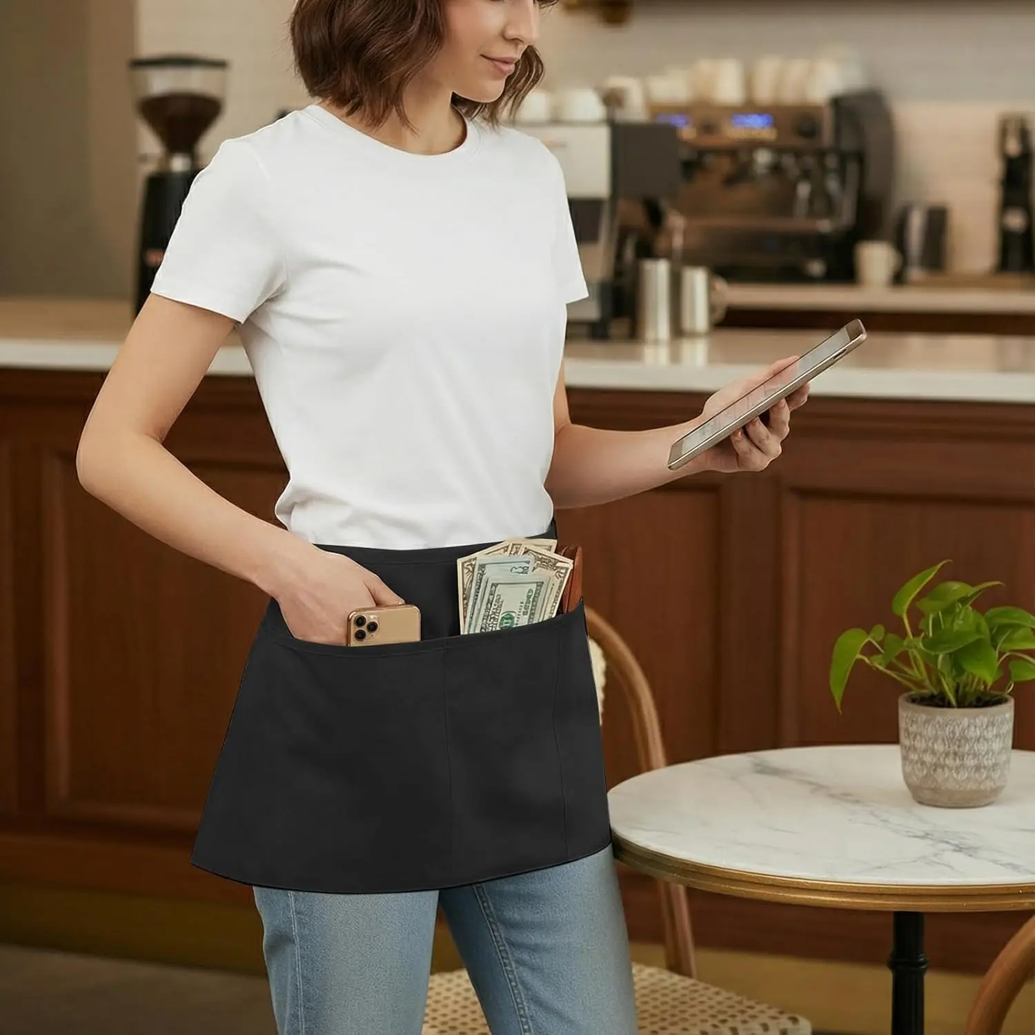 1 kitchen apron with pockets, suitable for female and male servers to wear, can be paired with formal or casual wear, made of stain resistant and easy to clean fabric, suitable for use in restaurants, hotels, and other places.