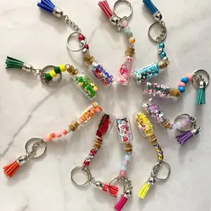 Mini Bottles Filled Without Love - Colorful Beaded Keychains with Tassels and Various Contents Displayed