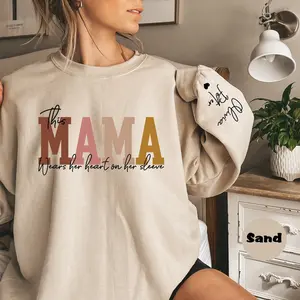 Custom This Mama Wears Her Heart On Her Sleeve Hoodie, Personalized Mom Sweatshirt With Kids Names, Cute Momma Outfit, Mothers Day Gifts W
