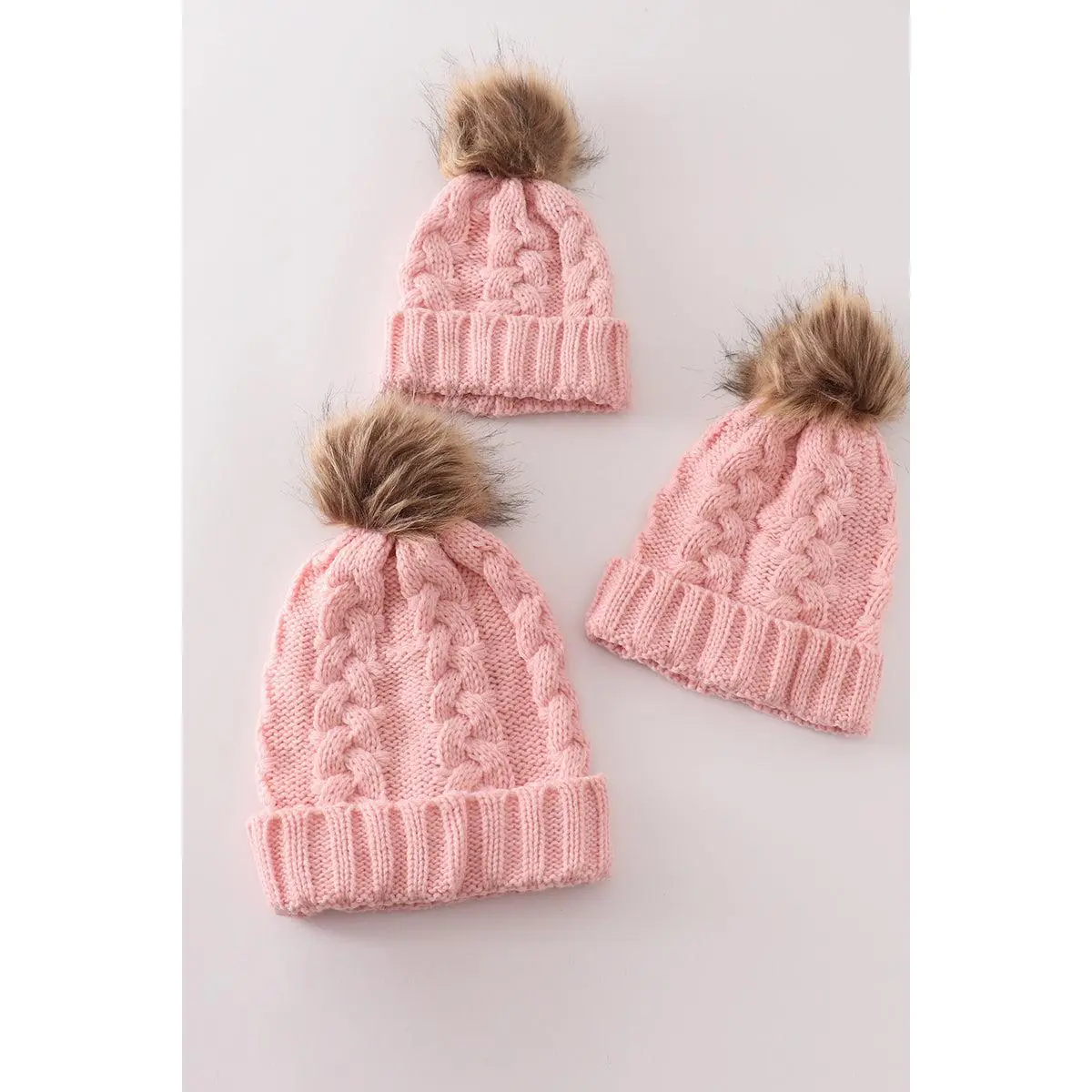Pink pompom cable beanie