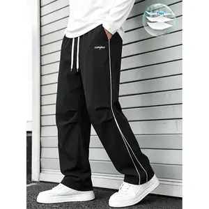 Men’s black ultra-thin quick-dry pants with double white stripes on the sides, drawstring waist, embroidered “campus” design, loose straight-leg American campus casual long pants
